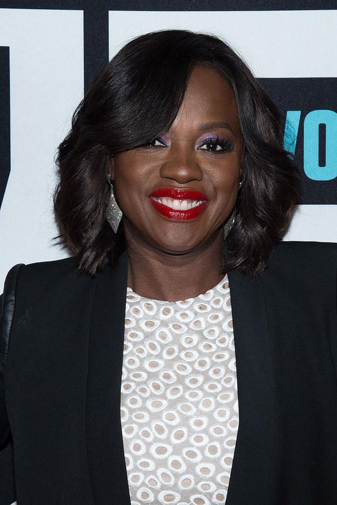 Red lipstick and violet eyeshadow were a stunning combination at a Bravo event.
