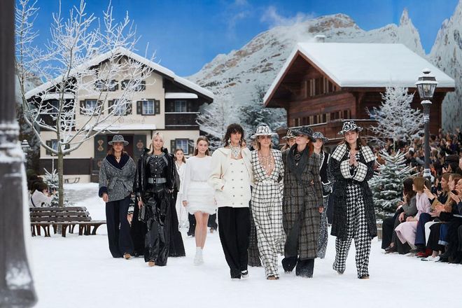 At Chanel’s first show since Karl Lagerfeld’s passing, the mood was poignant, but blended with a sense of uplift. The audience at the Grand Palais was transported to Alpine heights, seated among charming Chanel chalets, while the collection presented was a fresh, energetic take on classic Chanel codes. Opening with soft trouser suits swathed in long coats with wide lapels, it was a wintertime continuation of the easy, breezy spirit he presented at the Chanel seaside last season. Options for Chanel die-hards included: Après-ski knits, a new take on tweed (short skirts over long shorts), ruffled organza blouses, searing colours on classical skirt suits and brilliant winter whites.