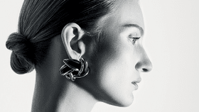 Bodysuit; earrings, Saint Laurent by Anthony Vaccarello. Photo: Gan