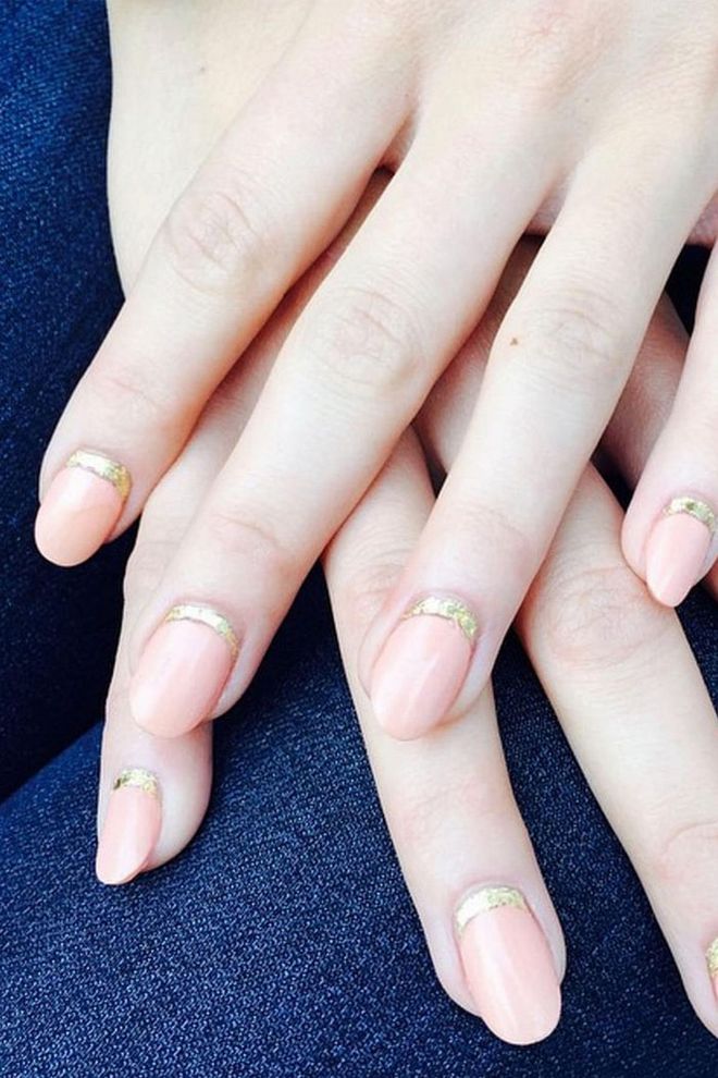 A subtle strip of gold painted along the cuticle gives an ordinary neutral a festive upgrade.
@jennahipp