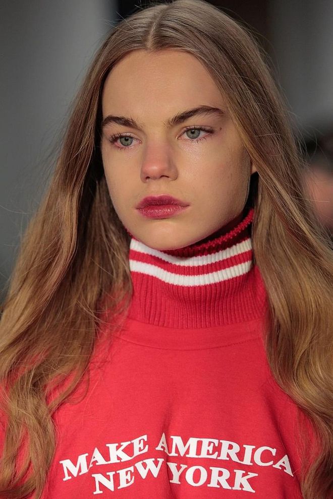 Lips (amongst other things) make a statement at the Public School show.  Models wear a pink stained pout in an ombre-lip fashion. Colour is saturated at the center and diffused out. Photo: Getty 