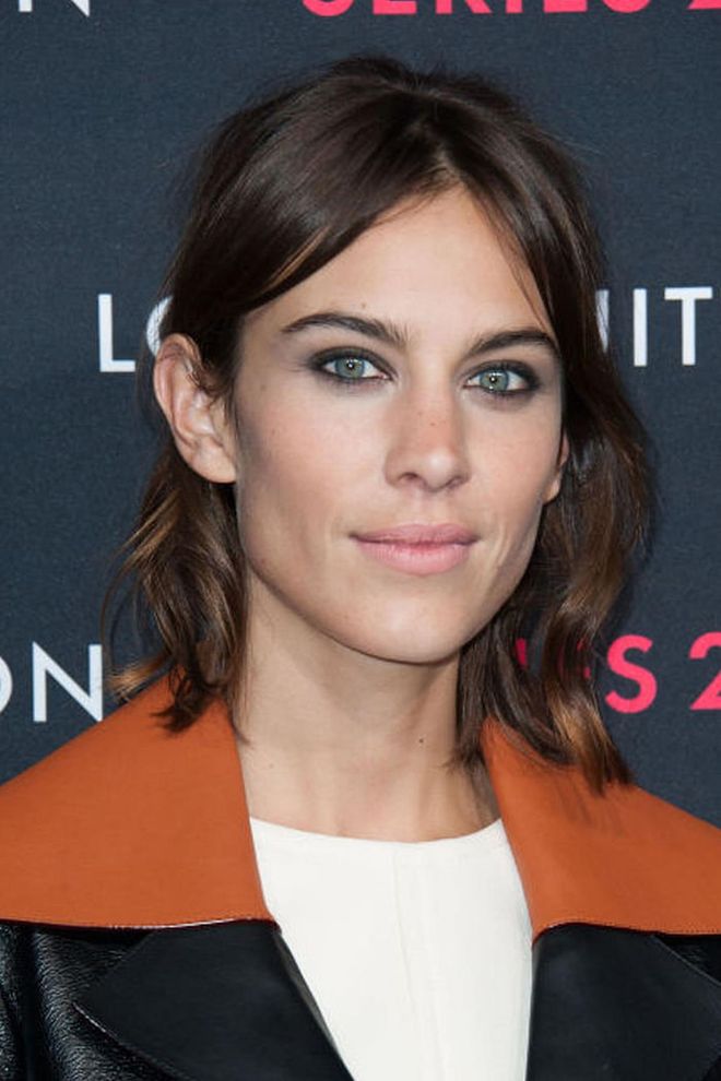 Trust Alexa Chung to keep it both simple and fresh with a middle part, pulled-back hair, and natural-looking waves. Photo: Getty