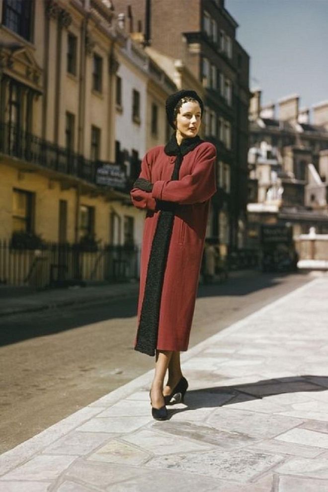 A model posing in a long red winter coat.

Photo: Getty