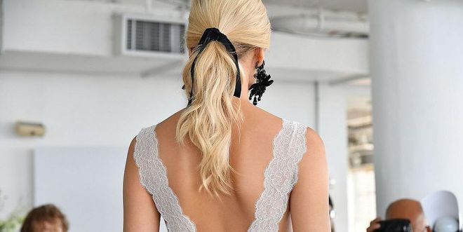 At the Marchesa spring 2018 bridal show, models wore black ribbons tied around wavy ponytails. Photo: Getty 
