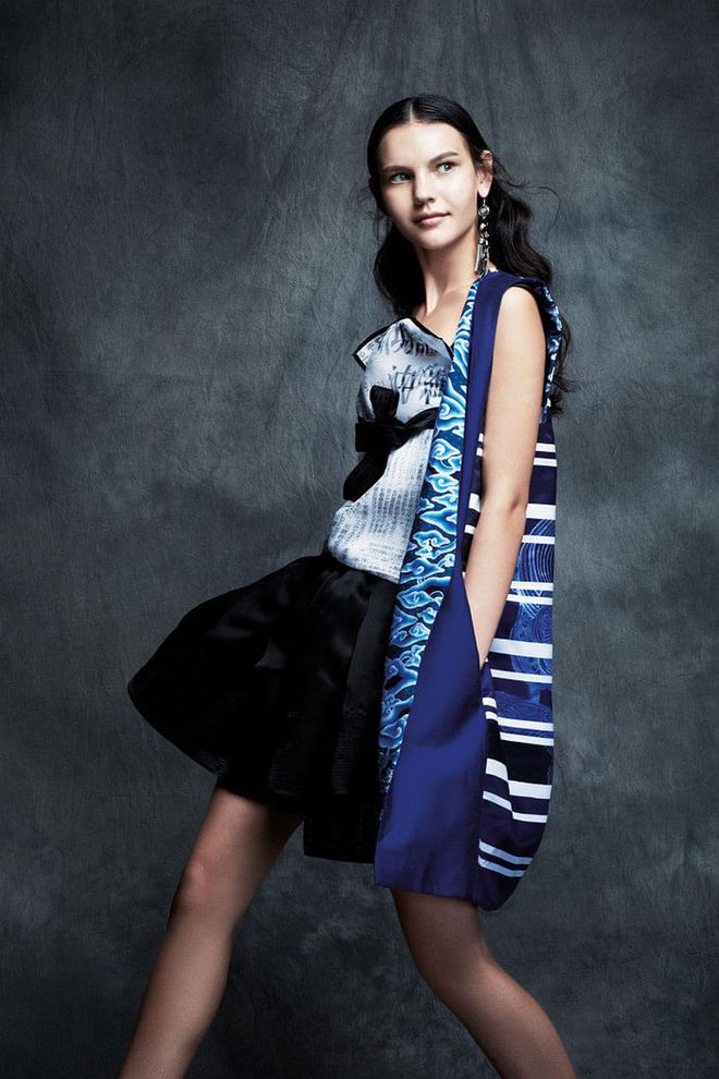 Coat; top; skirt, Silvia Teh. Earring, H&M