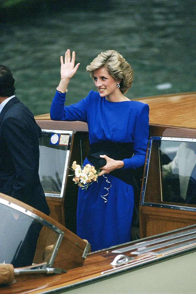 In a royal blue dress by Bruce Oldfield while on a boat ride in Venice, Italy. Photo: Getty