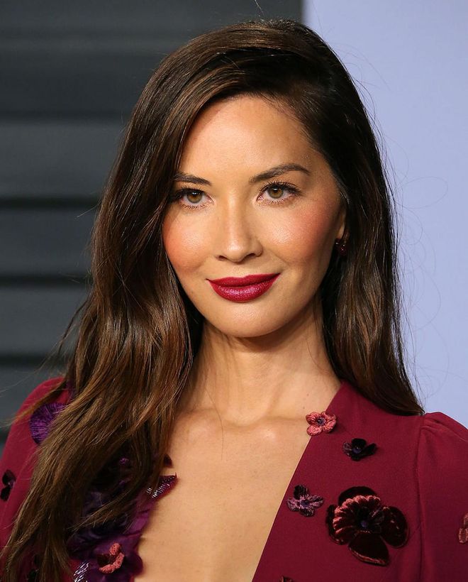 For the bride who wants a pop of color, take a cue from Olivia Munn and pair a rich and creamy plum lipstick with a similar shade blended across your cheekbones. Keep your eyes light and minimal, with only a few coats of defining mascara.
Photo: Getty