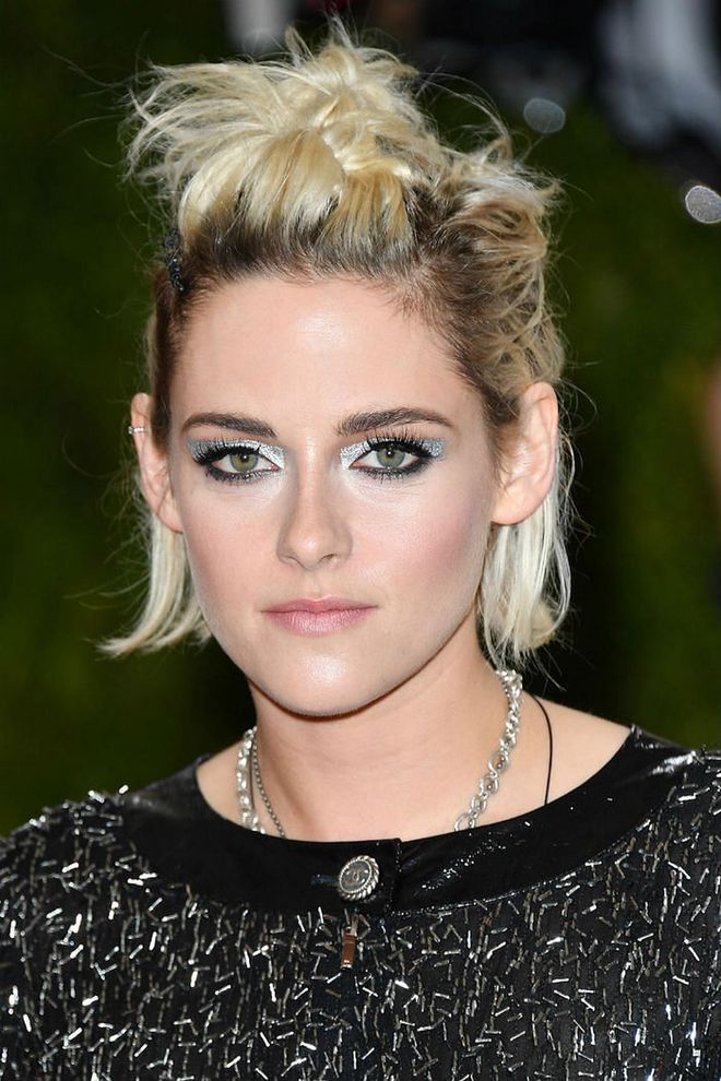 Metallic eye makeup paired with short, twisted tresses is the kind of pretty punk look we didn't know we loved. 
