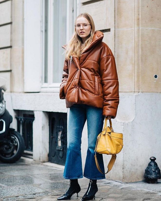 Despite our love and obsession for cropped high waisted denim, flare leg jeans are still just as chic. Play with proportions and lengths by pairing them with sleek patent leather kitten booties. Photo: Instagram/@sandrasemburg