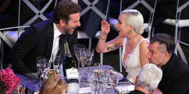 Talk about a bond. Cooper lost it over Gaga's jokes as they sat together at the SAG Awards.
Photo: Getty