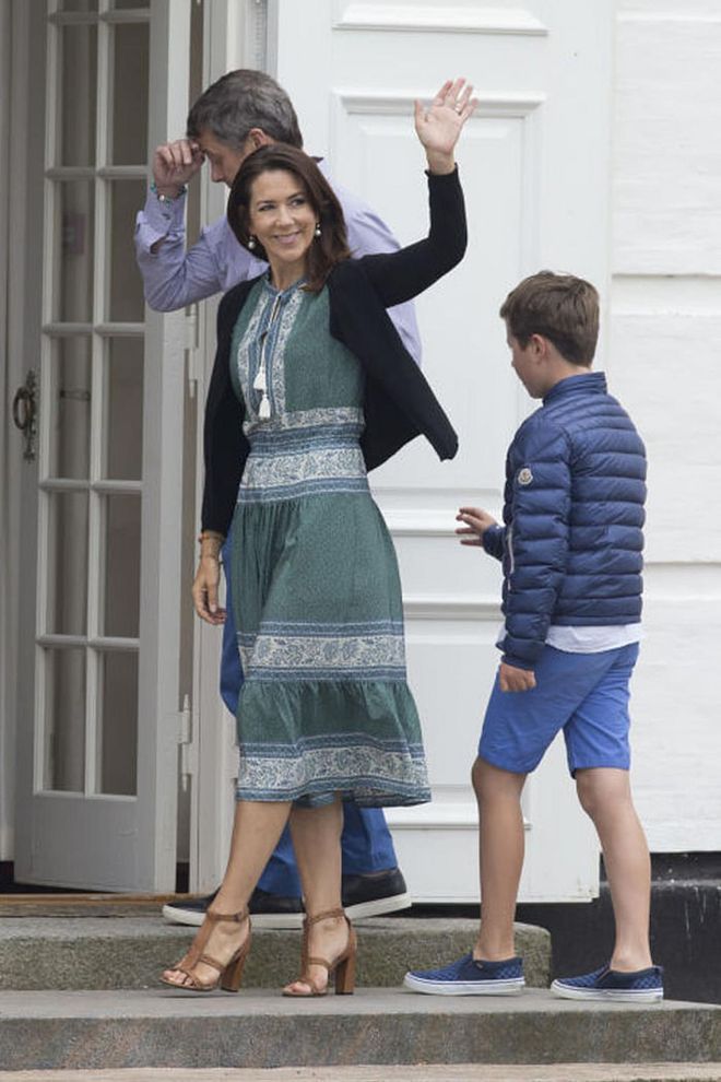 Princess Mary is pictured here in a SEA NY bohemian dress, sweater and heels for her family's annual summer photo.

