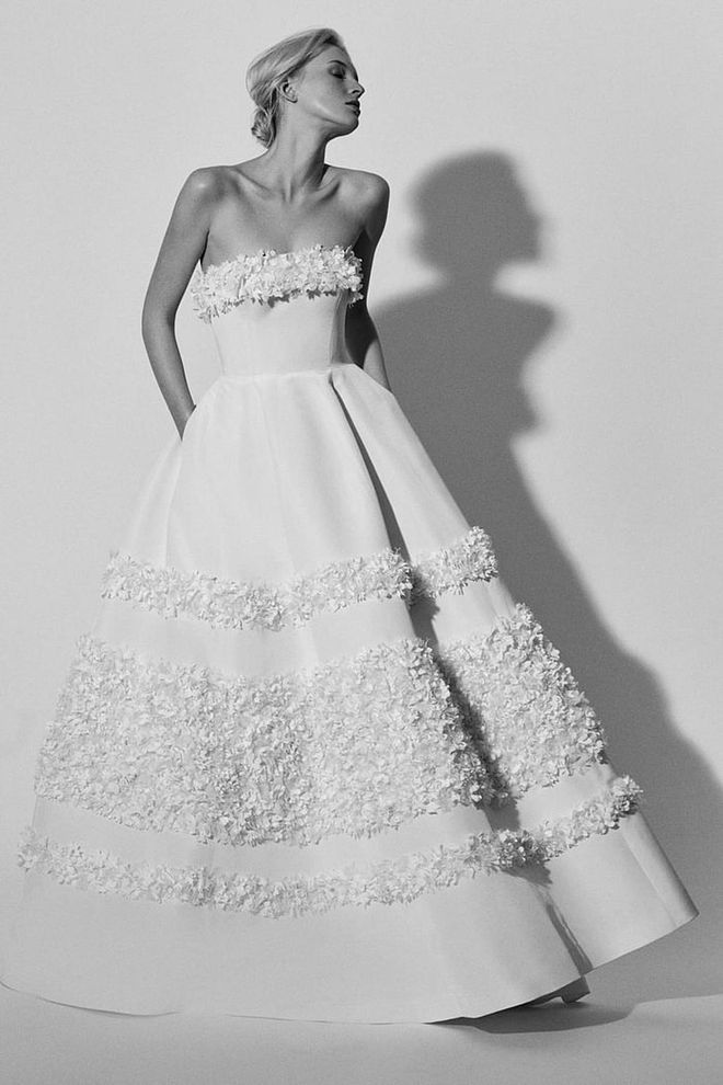 Floral, plush details suit any country setting- from a mountain top to a rustic church- and they look stellar when paired with a dramatic bouquet. Carolina Herrera "Flora" gown, carolinaherrera.com.  
