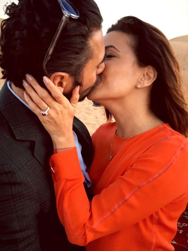 Longoria's boyfriend, Jose Antonio Baston, proposed in Dubai with a ruby ring surrounded by diamonds. Longoria shared a sweet snap of the couple on Instagram, writing, "Ummmm so this happened....#Engaged #Dubai #Happiness"


