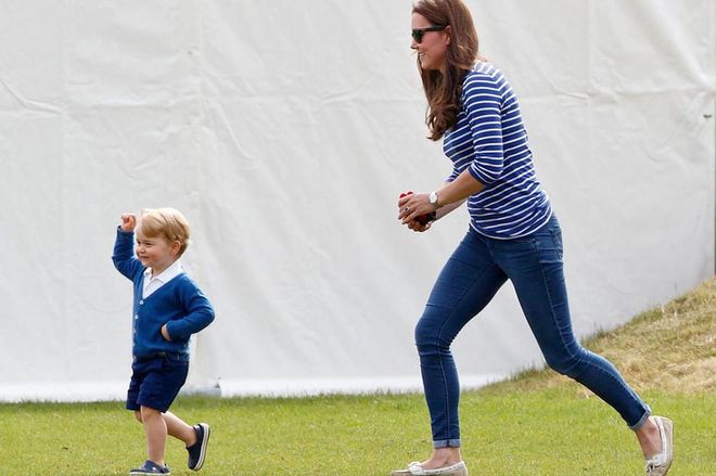Middleton chases after Prince George with toys in hand at a charity polo match in Tetbury, England.
Photo: Getty