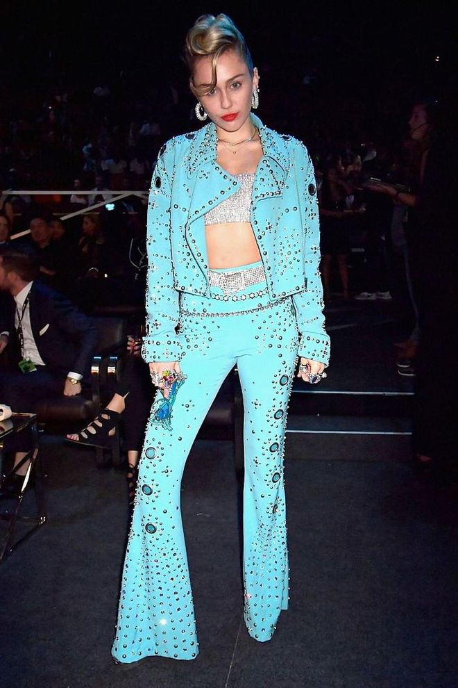 The singer gave a nod her Southern roots in a turquoise cowboy-esque jacket and bellbottom pants by Moschino.