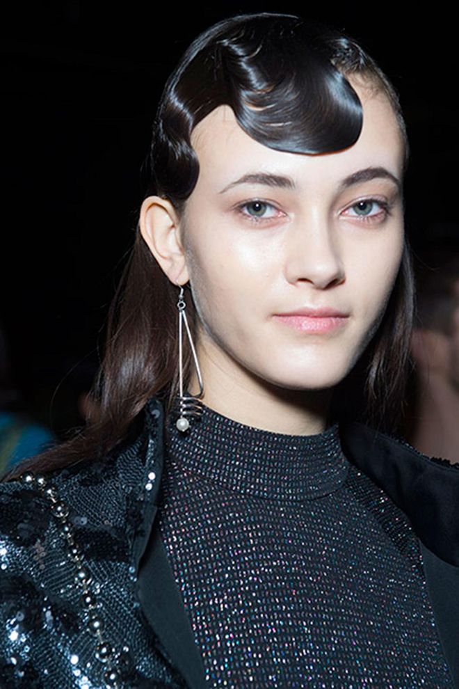 High shine finger waves were teamed with glossy loose hair at Opening Ceremony for an eye catching dual-texture look.