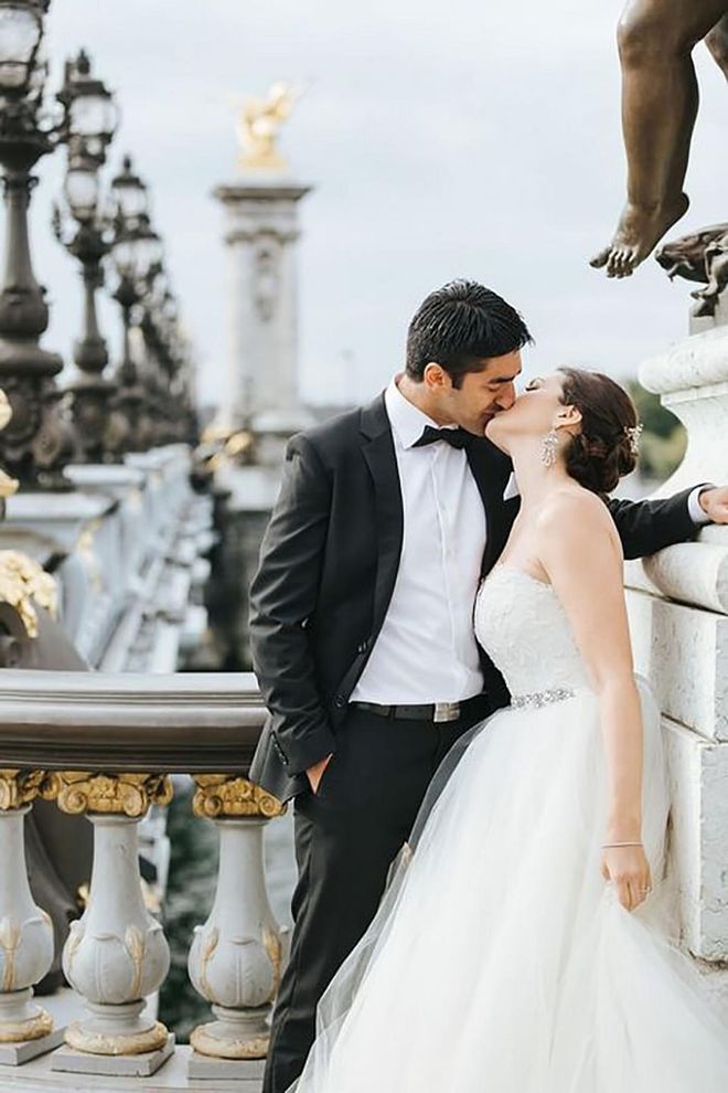 Before hopping off to a magical ceremony outside the city at Chateau de Chantilly, one couple shares a kiss atop the Pont Alexandre III bridge. Amid those shining golden details, the couple could pass for a real-life prince and princess.

Via The Flying Poodle Photography