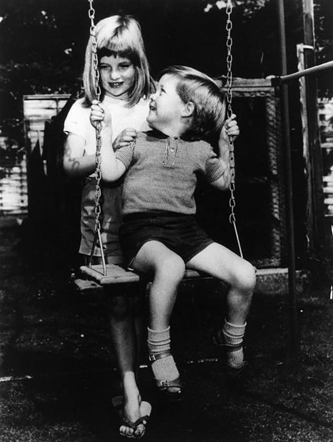 Diana playing with her brother Charles Edward Maurice on the grounds of Park House, Sandringham when she was six years old.

Photo: Getty