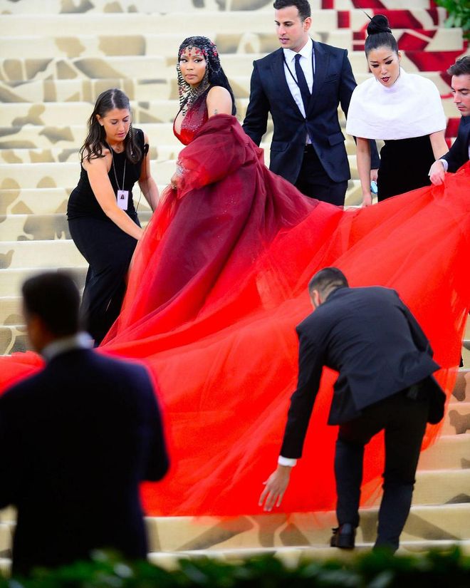 Proof that the perfect shot at the Met Gala steps doesn't come easy. Photo: Getty 