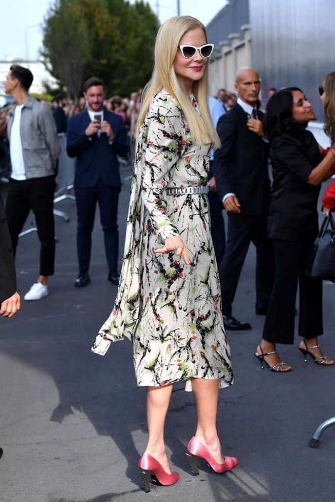 Nicole Kidman arrived at the Prada show wearing a patterned dress and statement heels.

Photo: Getty