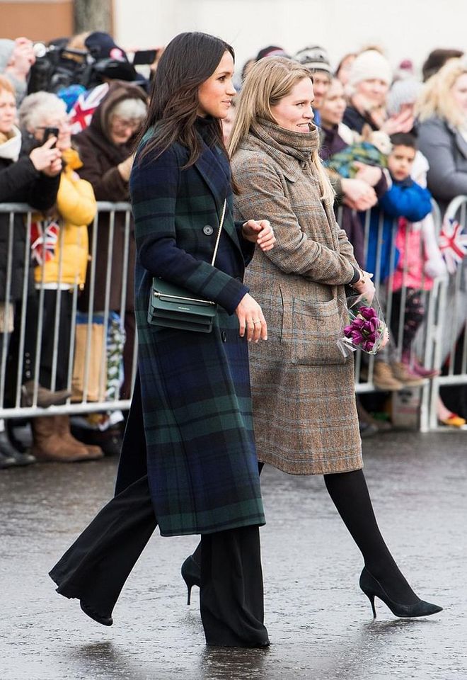 In Meghan's first official visit to Edinburgh, she naturally wore tartan in Scotland's most beloved colour, green! She donned a crisp Burberry double-breasted tartan wool coat over leg-lengthening Veronica Beard 'Adley' pants and accessorized with a forest green crossbody from her go-to bag-brand, Strathberry. 