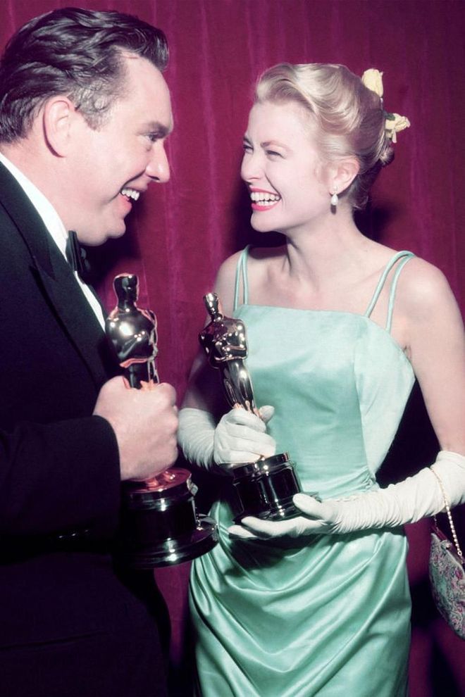Winning Best Actress for The Country Girl, Grace Kelly proved that a smile is your best accessory for a vibrant Givenchy gown.