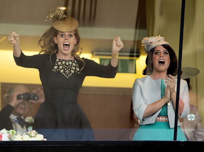Princess Beatrice and Princess Eugenie celebrate from the royal box on Ladies Day of the Royal Ascot in 2013.
Photo: Getty 