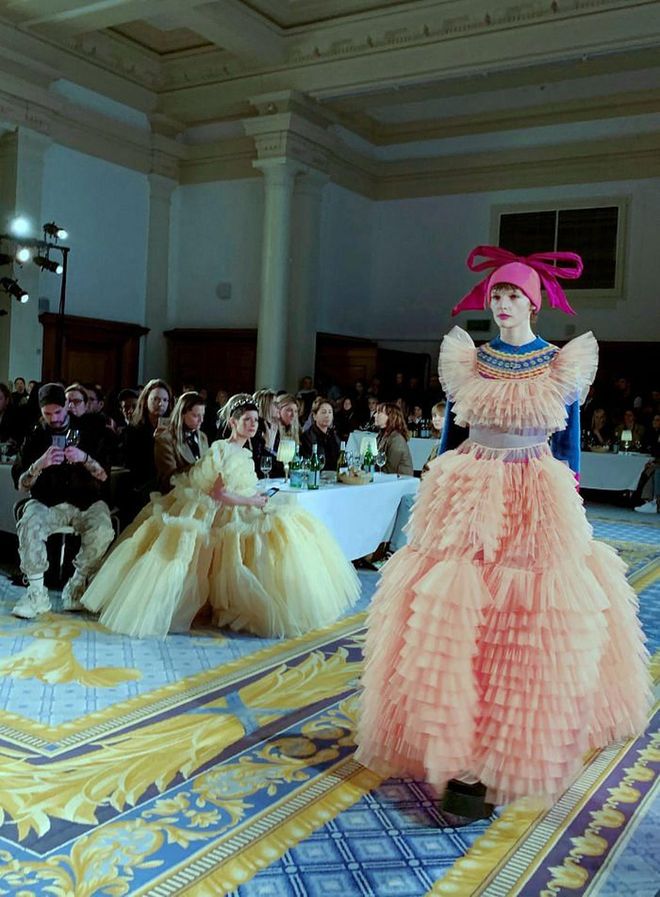 Could maximalist style star and jewellery buyer Lauren Kulchinsky Levison (seated, in yellow dress) be eyeing that salmon pink frou frou Molly Goddard number on the catwalk.