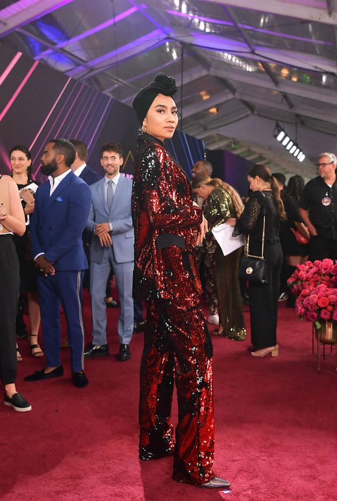 Yuna wears a custom-designed sequin suit by Marcell Von Berlin.

Photo: Getty