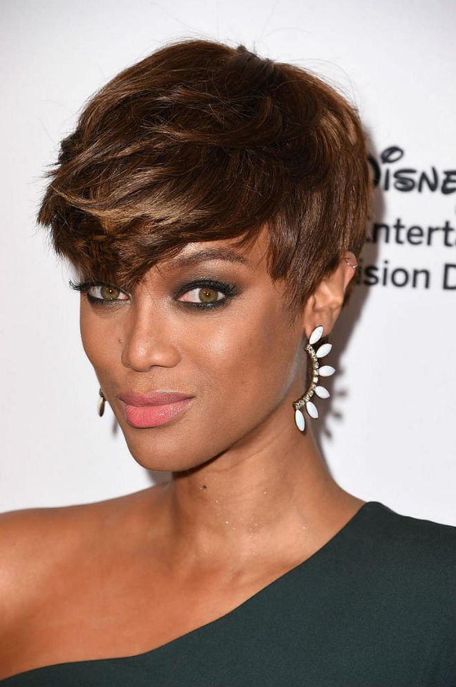 The uneven "heavy bangs plus short sides" look is definitely A+, but don't forget to smize when showing off your new 'do. Photo: Getty