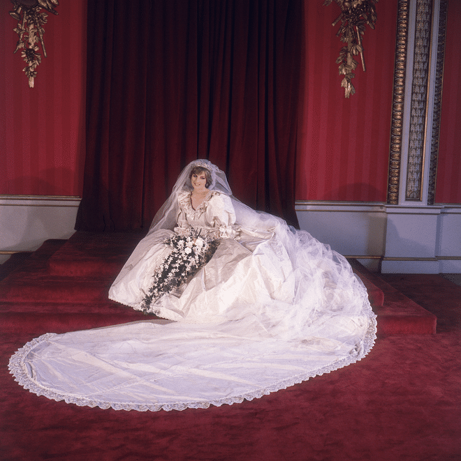 Diana's ivory taffeta wedding dress was made by husband-and-wife design team David and Elizabeth Emanuel. The gown boasted over 10,000 pearls and a 25-foot-long train, one of the longest royal trains the world had ever seen.
Photo: Getty