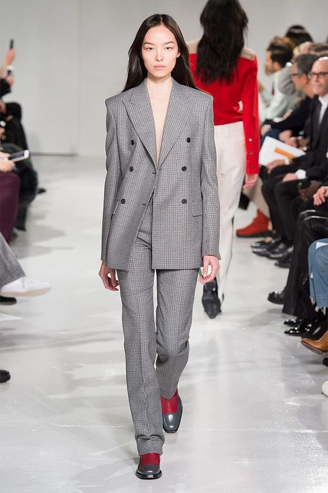 The classic gray suit is getting a high fashion reboot, and it's never looked more appealing. 
Pictured: Calvin Klein 
