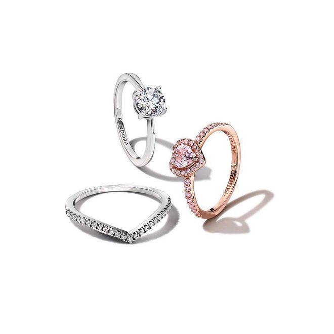 From top: Sterling silver Sparkling solitaire ring, $99; rose gold-plated Sparkling Elevated Heart ring with orchid pink crystals, $159; sterling silver Sparkling Wishbone ring, $69 (Photo: PANDORA)