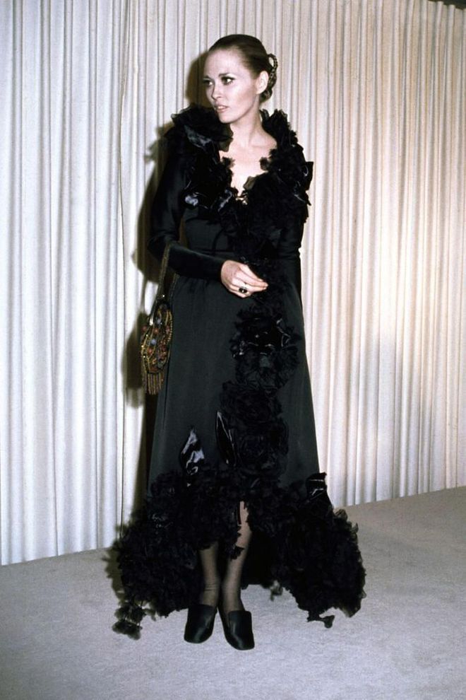 Faye Dunaway brought the drama in a black ruffled wrap dress, and slicked back hair.