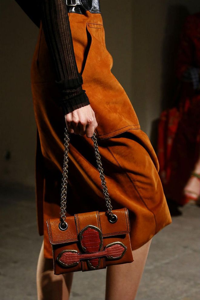 Seen at: Milan Fashion Week//Why we love it: Light travelling takes on the luxe road. This number by Bottega features glistening chain straps that hold together a nifty clutch in sumptuous leather. (Photo: Getty)
