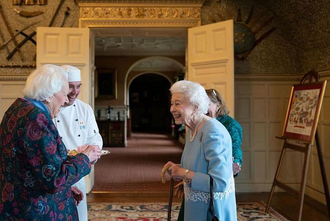 Queen Elizabeth speaks with Angela Wood. (Photo: Joe Giddens/Getty Images)
