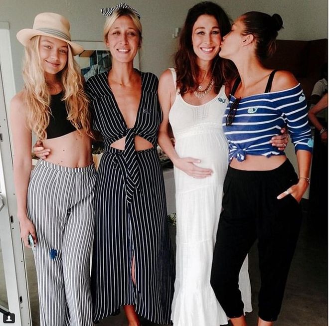 The best way to wear pants at the beach is if they're light and cotton so you're not schvitzing in the sun. Gigi's look especially flattering since they're high waisted and paired with a bikini that doubles as a crop top. <b>Sady & Lu Striped Linen Beach Pants, S$108</b>