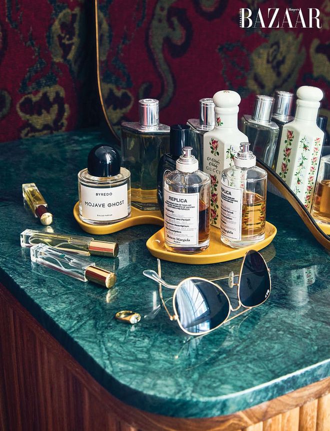 Some of his favourite fragrances from Maison Margiela, Gucci and Byredo sit on a marble top counter near the entrance