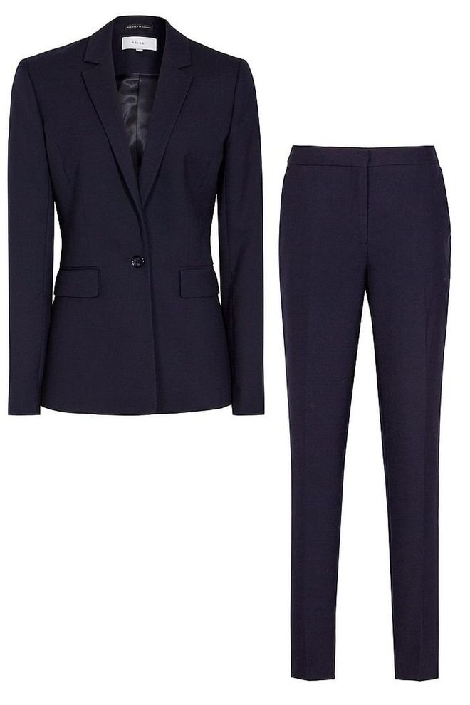Whether you go wide-leg or slim-cut, the suit is big news this season. This isn't an homage to the 80s though - keep yours nipped in at the waist for a more flattering silhouette.
<b>Navy trousers, £125, jacket, £230, Reiss</b>