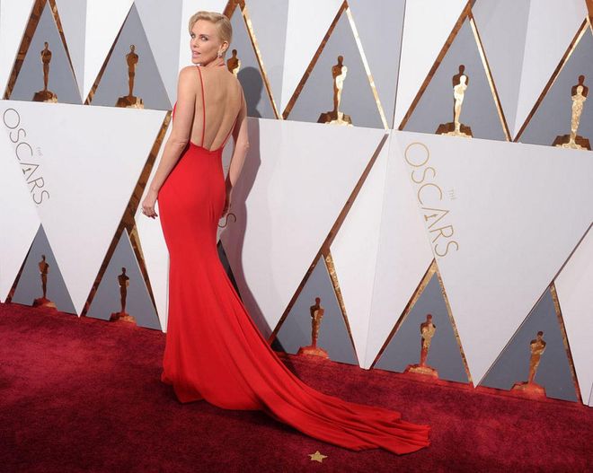 The Academy Award veteran always slays the carpet, but last year Theron looked especially red hot in this plunging front and back Dior number, accessorized with a long diamond necklace and bling-y diamond ring.
