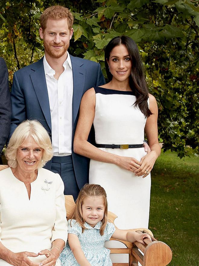 The Duchess of Sussex wears another look from her go-to brand Givenchy, this time a black and white sheath dress for the royal family portrait. The dress, which features a black and white contrast along with a boat neckline. 