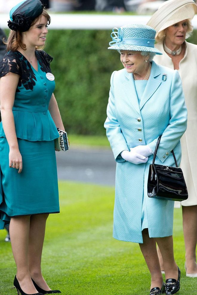 Queen Elizabeth and Princess Eugenie match in blue at the Royal Ascot. Photo: Getty