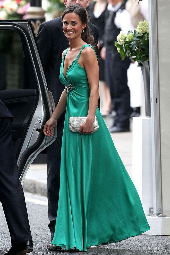 The Maid of Honor trades her white McQueen gown for a bright green dress custom made by Alice Temperley of Temperley London.

Photo: Getty
