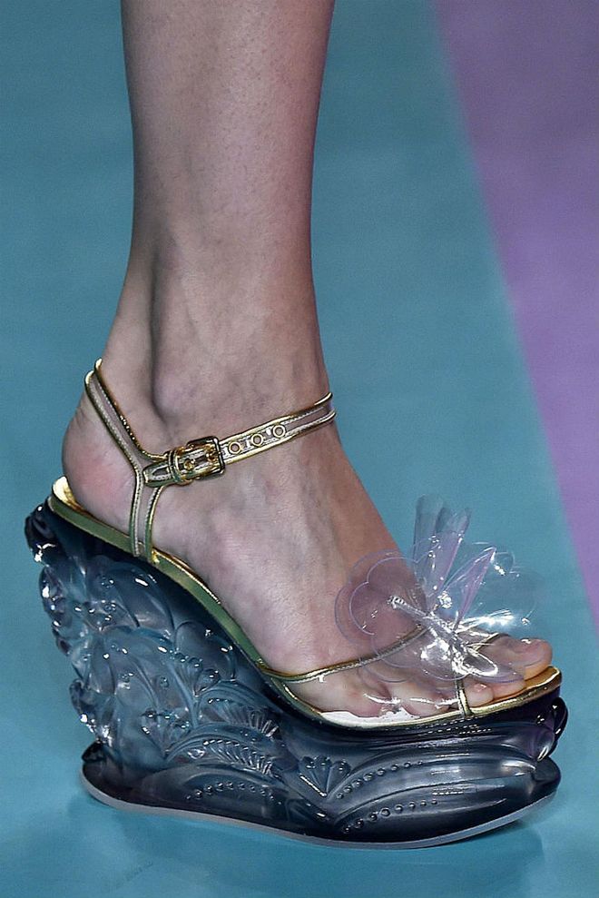 Seen in: Paris Fashion Week SS17 // Reason to love: Miuccia Prada has always crafted brilliant shoes for Miu Miu that every woman crave for. This time is no exception. In line with its "chic poolside party set in the 50's" inspired collection, these sandals have floral cornice-like elements sculpted onto its wedge heels in a clear aquatic hue, making them absolute head-turners (Photo: Getty)