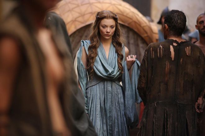 Margaery's go-to pulled back braid crown perfectly frames her wavy and luscious locks