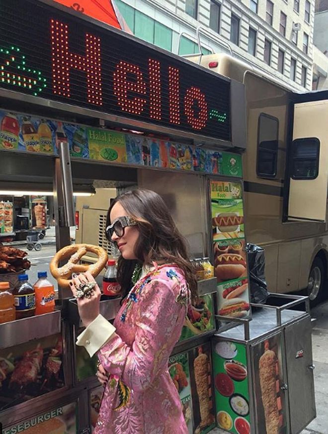 Only a true professional could enjoy a pretzel and not get mustard on her cuffs. (Truly, Dakota, how did you not get toppings on that jacket?)
Photo: Instagram
