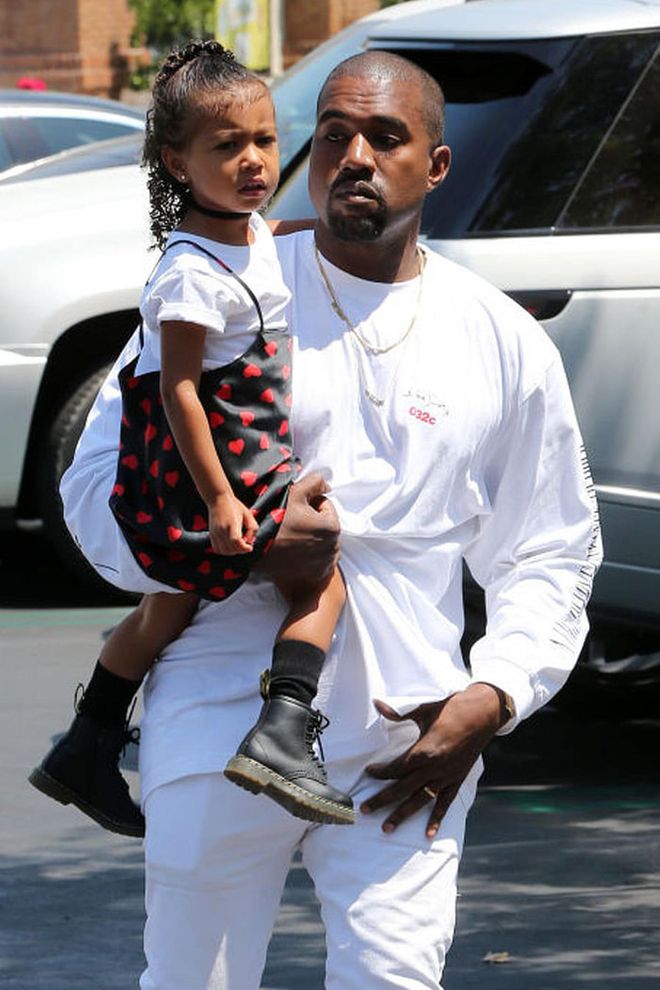 North graciously lets Kim Kardashian and Kanye West see Finding Dory at the movies with her while wearing a heart-printed slip dress over a white tee, a black choker and combat boots.