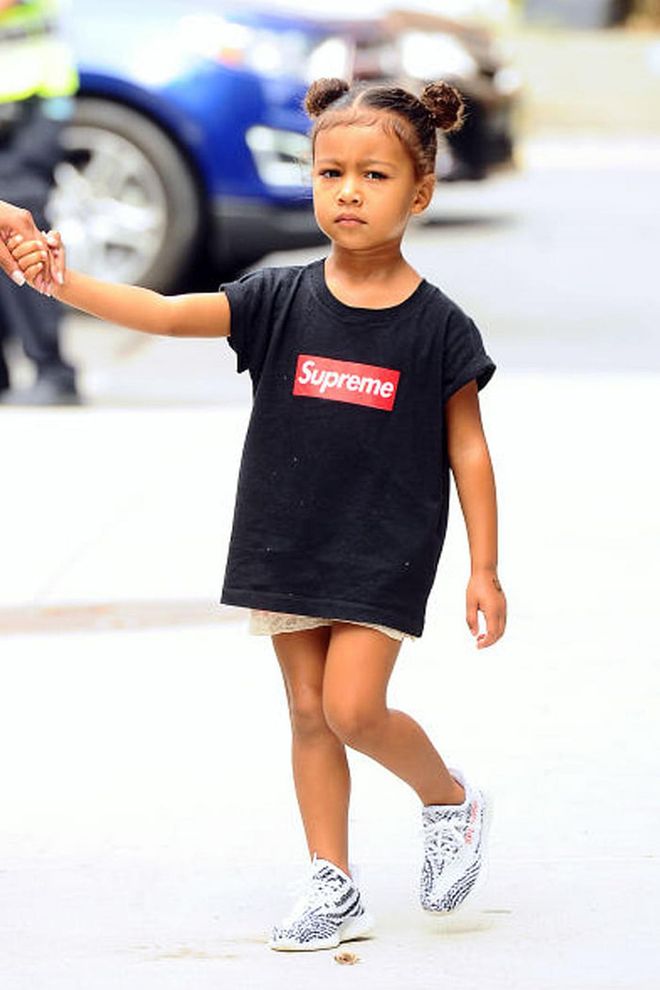 North's sporty-chic style game is going strong. The three-year-old stepped out in a Supreme t-shirt and not-yet-available Yeezy Boost sneakers. Photo: Splash 
