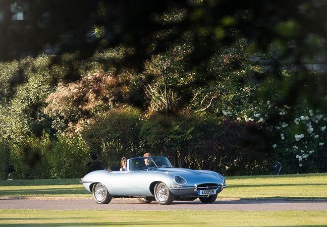 Prince Harrry, Duke of Sussex and Meghan, Duchess of Sussex drive off to their wedding reception in a blue Jaguar with a custom number plate that commemorates their wedding day. 