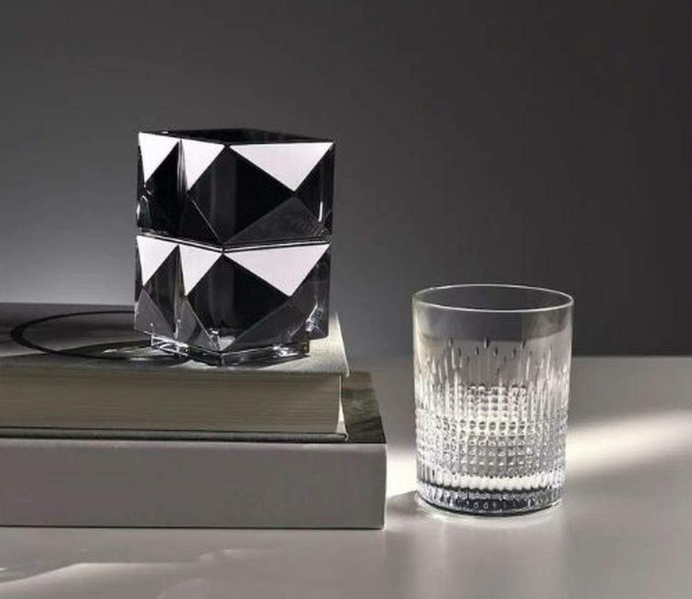 (From left) Baccarat louxor pencil holder in black crystal; Baccarat nancy and louxor glasses. Baccarat louxor pin tray in crystal